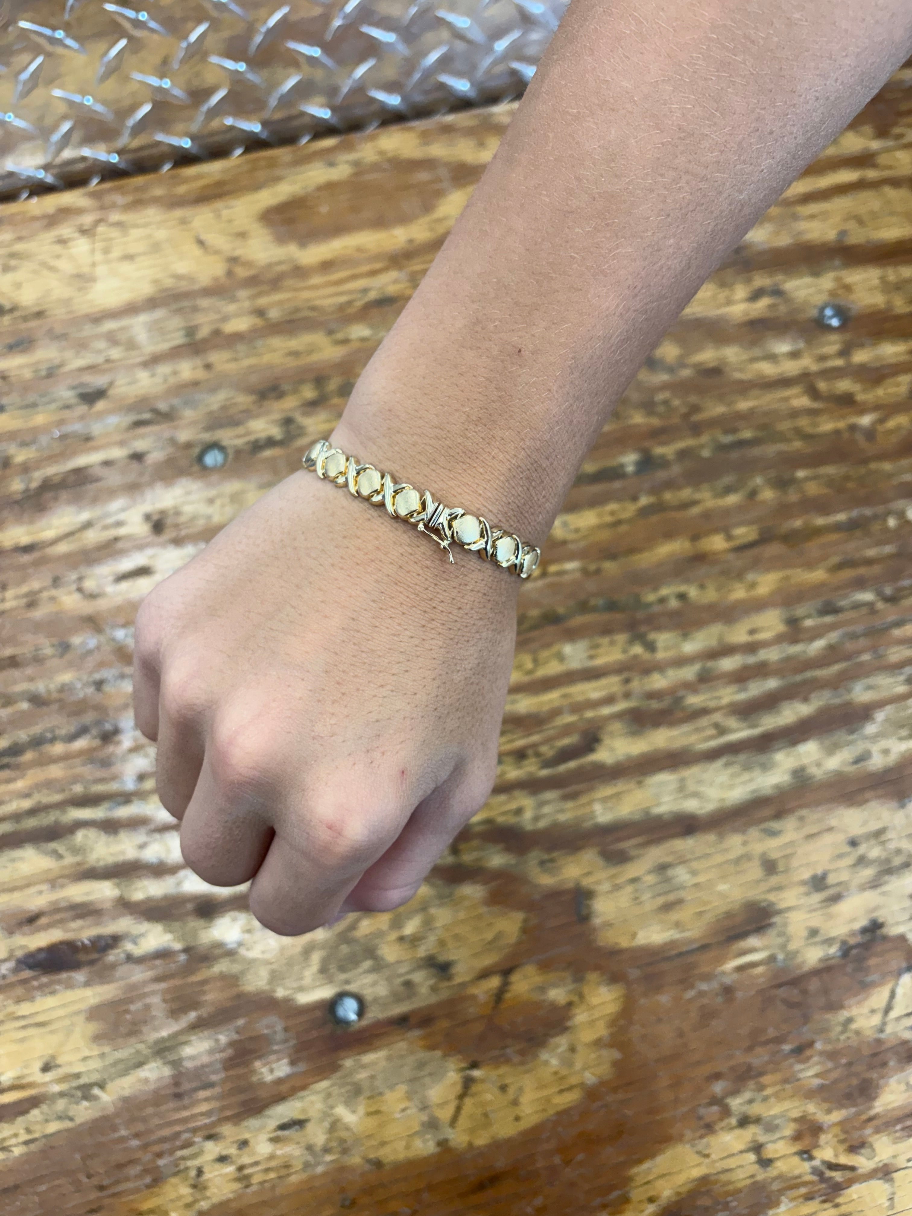 Woman’s 10K Yellow Gold X & O Semi Solid Bracelet 9.1 Grams 8 1/2 mm 7” $499.99 (863-777-GOLD)
