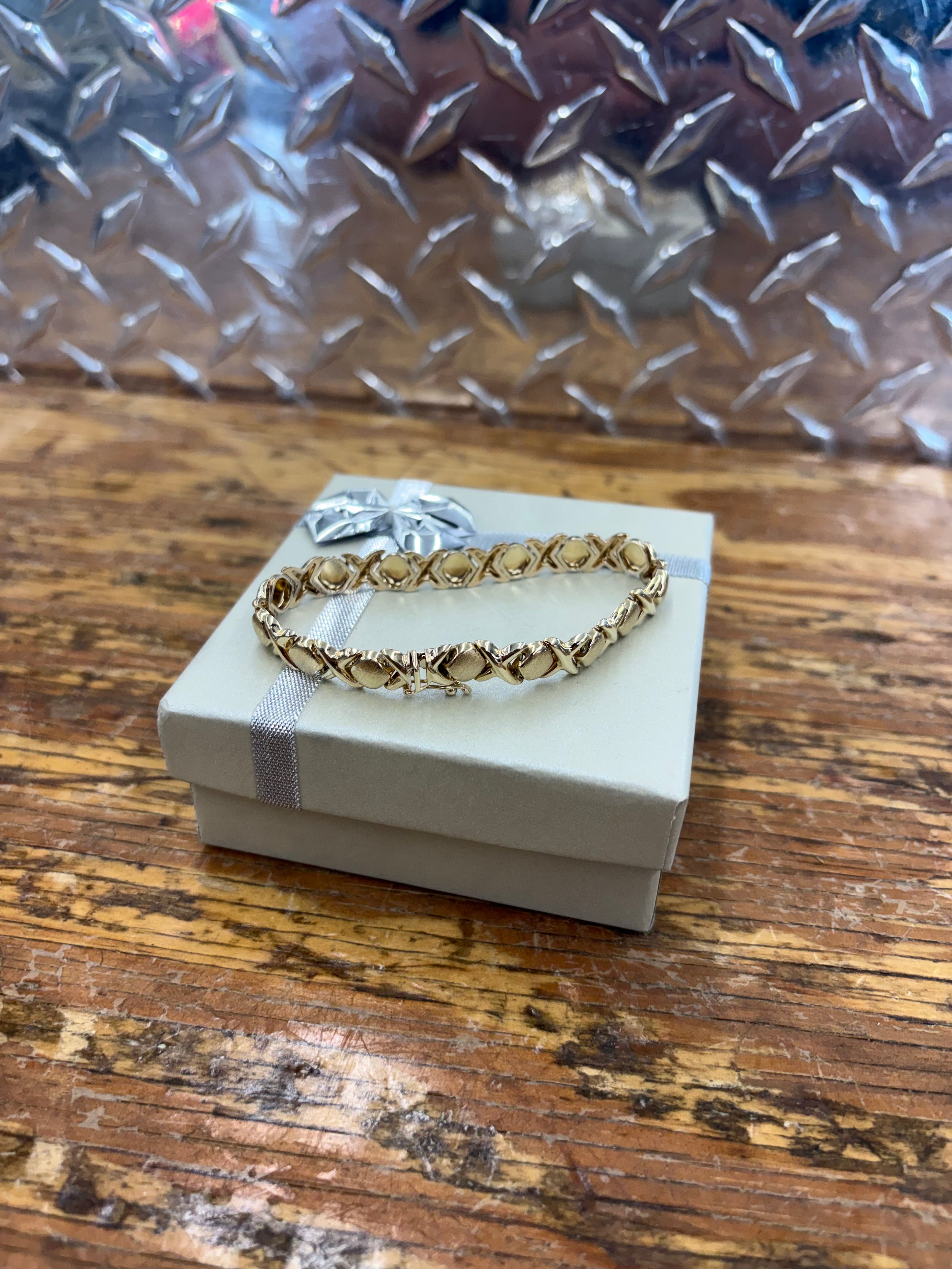 Woman’s 10K Yellow Gold X & O Semi Solid Bracelet 9.1 Grams 8 1/2 mm 7” $499.99 (863-777-GOLD)